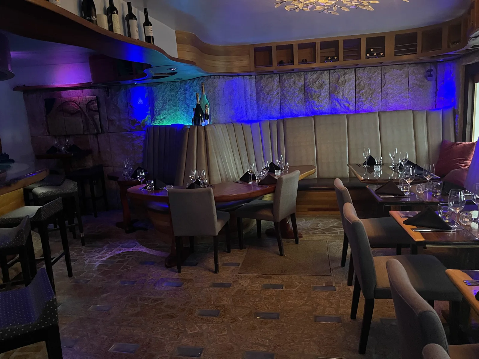 Wide view of the Niche dining room and wine wall